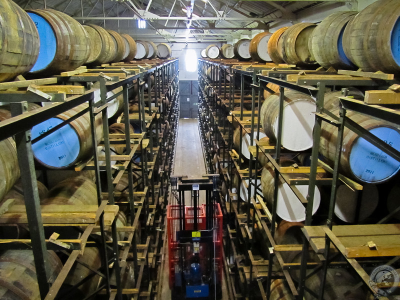 Climbing Atop the Stacks in the Warehouse at Glenglassaugh