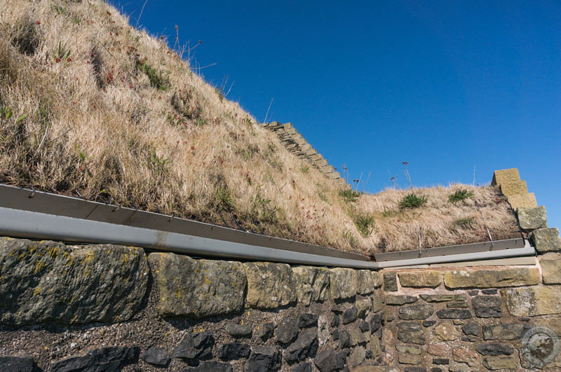 Beneath the thatch along Smailholm's roof