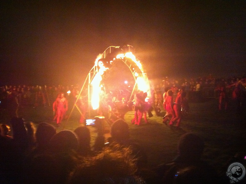 The Reds dancing through the flame arch